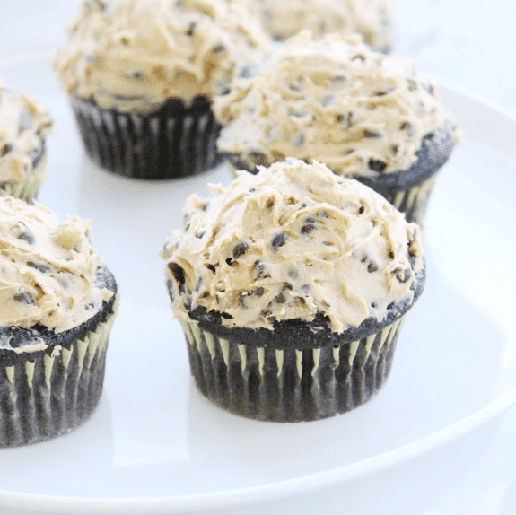 http://iambaker.net/wp-content/uploads/2017/03/Dark-Chocolate-Cupcakes-with-Cookie-Dough-Topping1-tableforseven.png