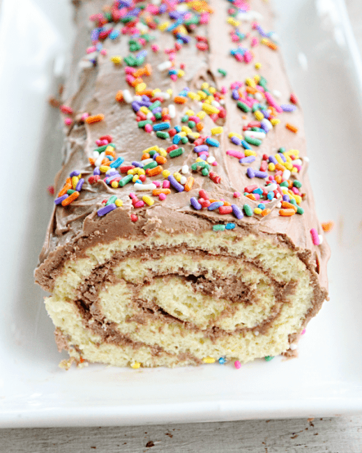 http://iambaker.net/wp-content/uploads/2017/05/vanilla-roll-cake-with-chocolate-frosting-www.ourtableforseven.com_-519x650.png