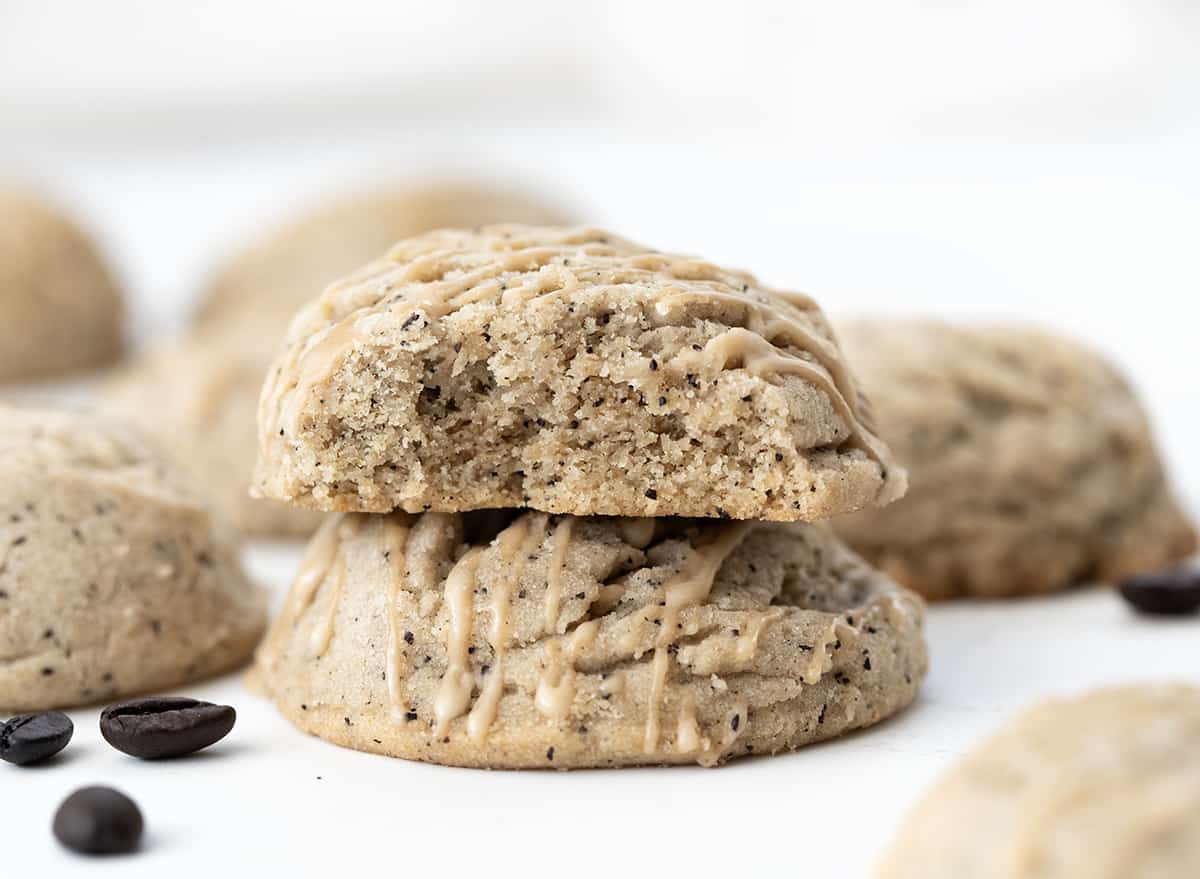 Stack of Coffee Sugar Cookies with the Top Cookie Broken in Half, Showing Inside Texture.