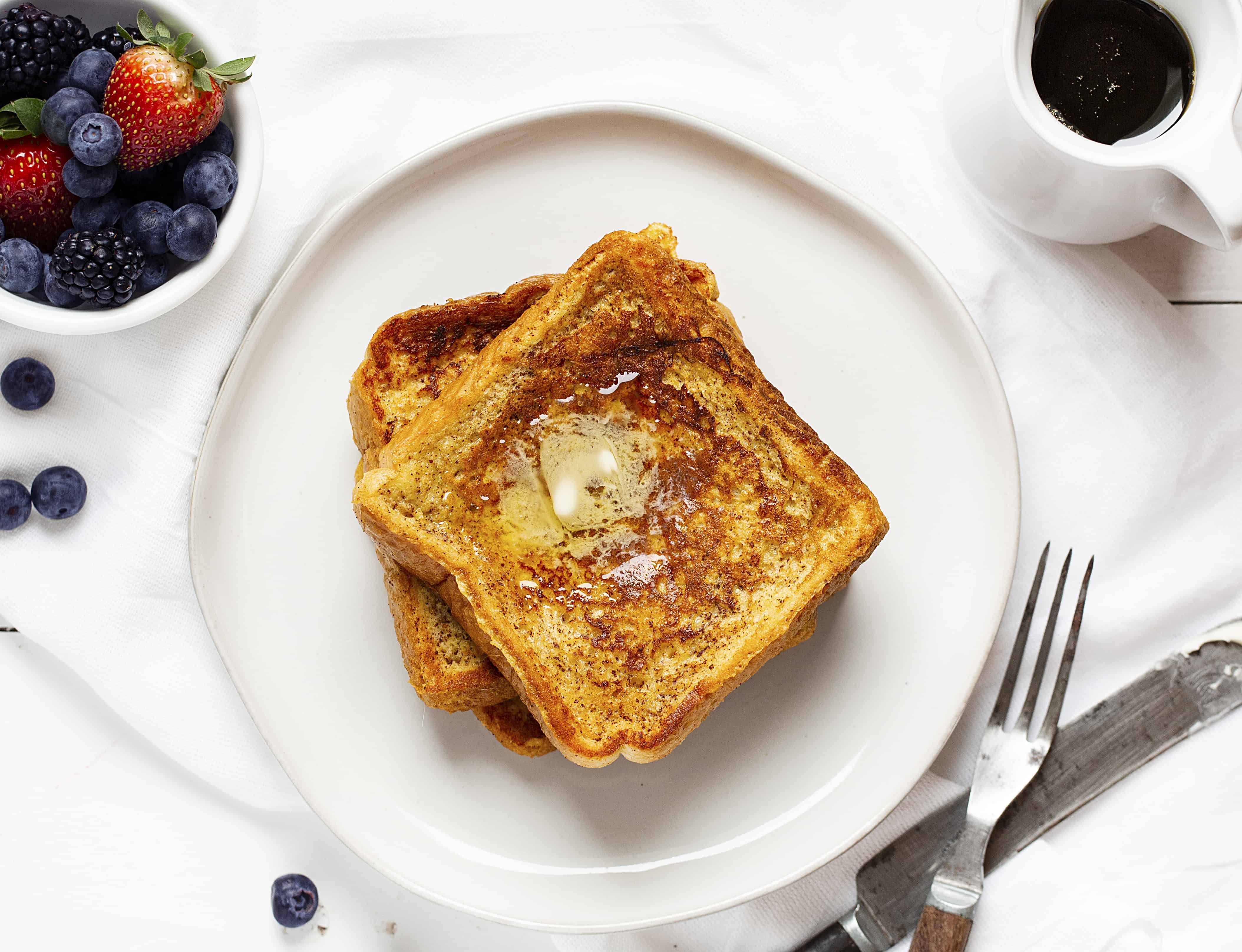 French Toast from Overhead with Fresh Fruit and Syrup. 