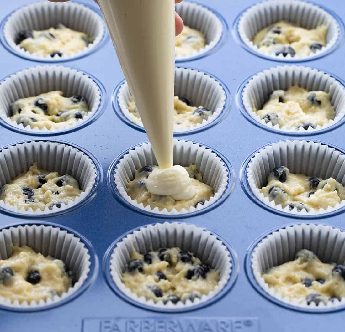Adding Cream Cheese to Blueberry Cream Cheese Muffins