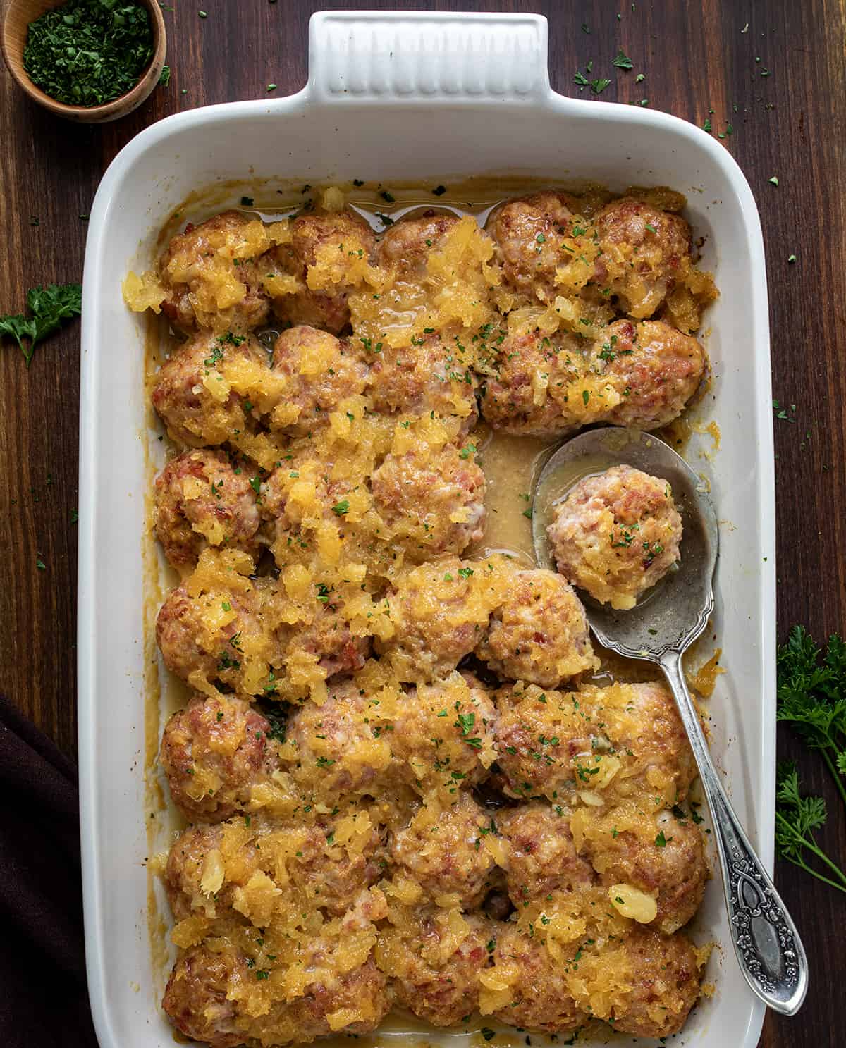 Pan of Ham Balls on a Dark Table from Overhead. 