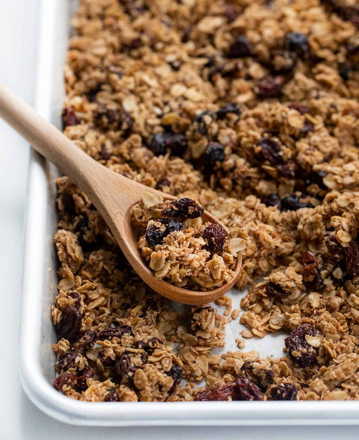 Spoonful of Homemade Granola on Baking Pan