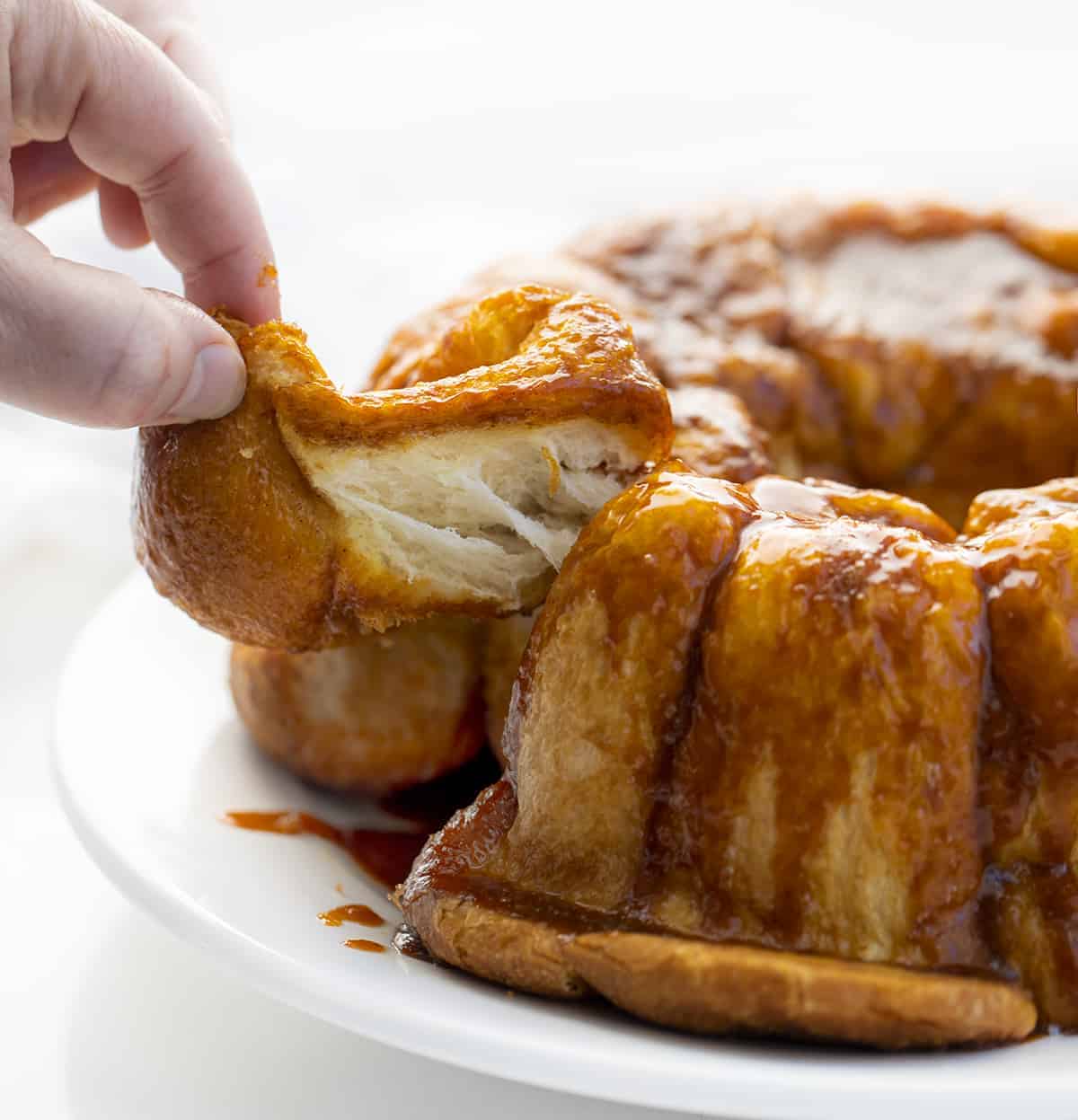 Hand Taking Apart 5 Ingredient Monkey Bread