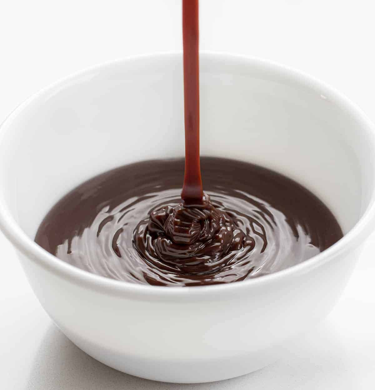 Pouring Milk Chocolate Ganache into a White Bowl