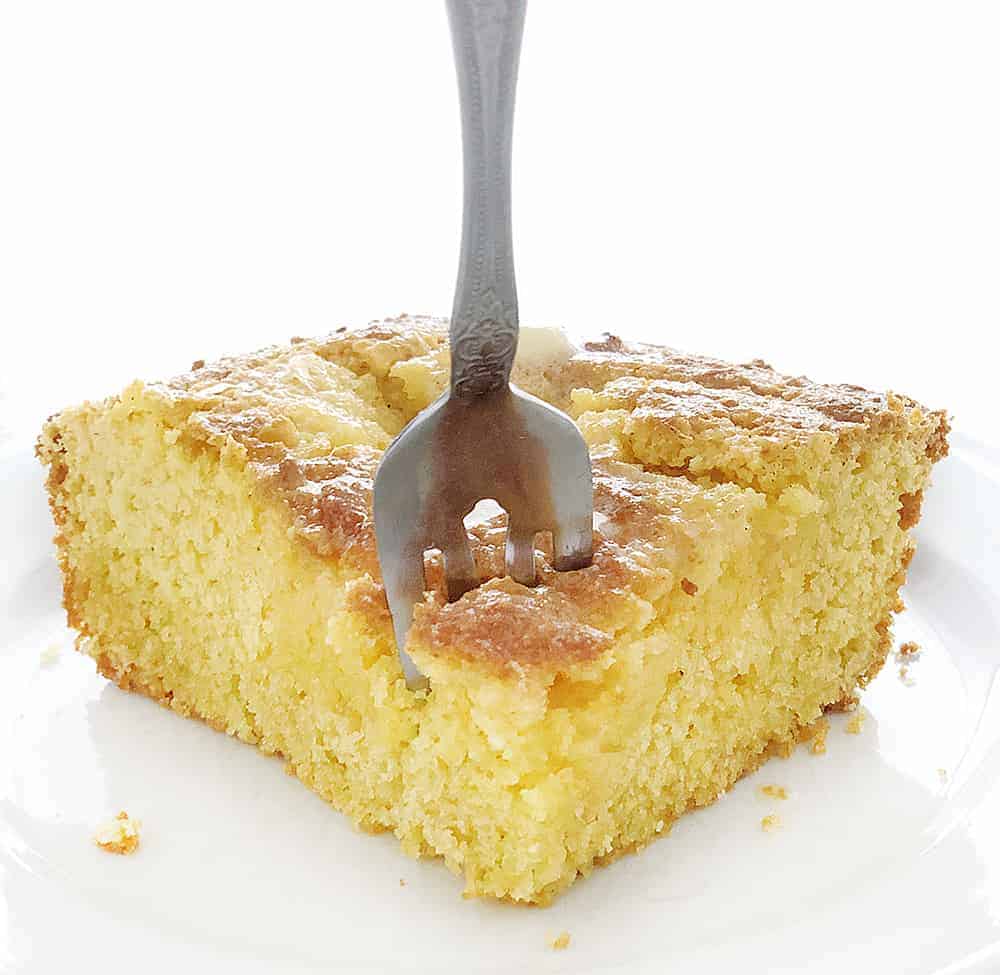 Sweet Cornbread Recipe, one piece with a fork taking a bite