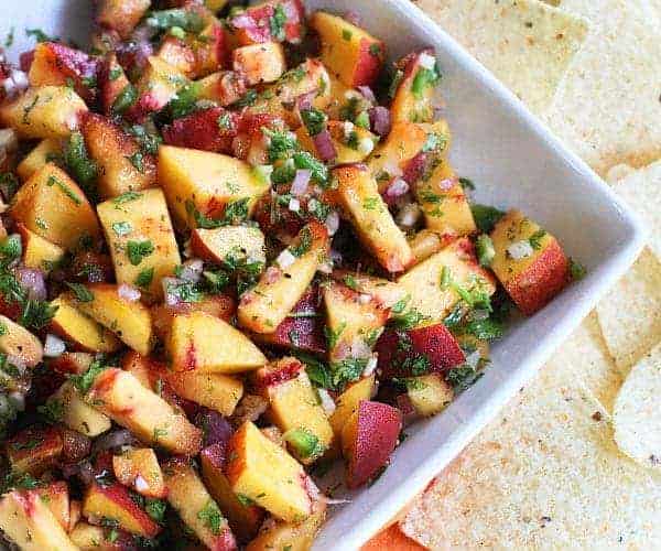 Cilantro Peach Salsa in Square Dish with Chip