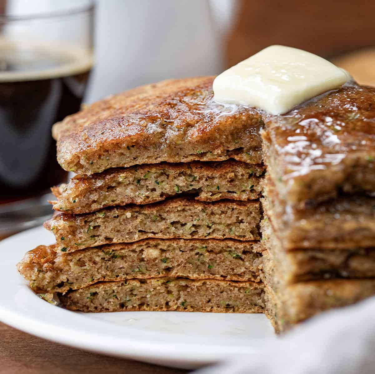 Stack of Zucchini Pancakes that have been cut into showing inside texture.