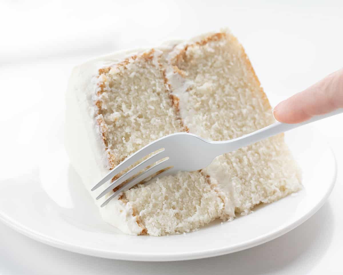 Fork Taking a Piece of White Cake .