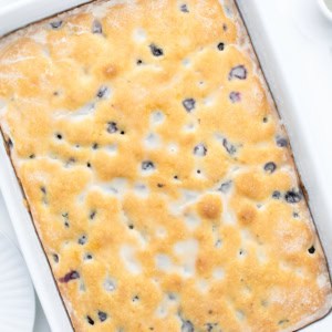 Looking down on a Blueberry Breakfast Cake on a white table.