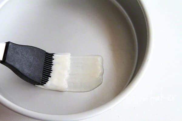Silicone Brush Spreading Homemade Pan Release Into Cake Pan.