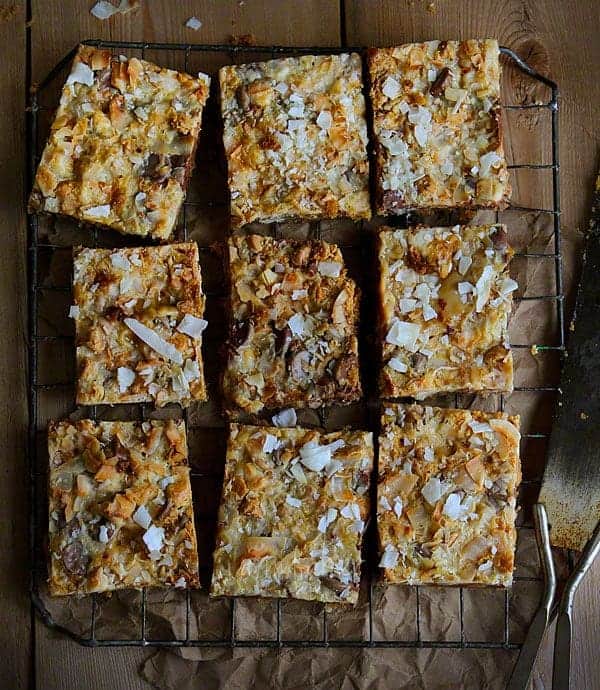 These Garbage Bars (also known as magic cookie bars) are a classic treat kicked up a notch! #magicbars #garbagebars #bars #iambaker #baking Garbage Bars Recipe