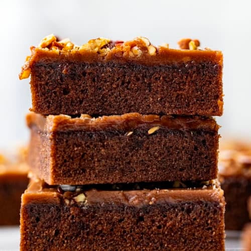 Stack of Texas Brownie Cake on a white table.