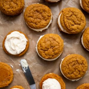 Some assembled and some still needing the top cookie for Pumpkin Sandwich Cookies with Brown Butter Buttercream.