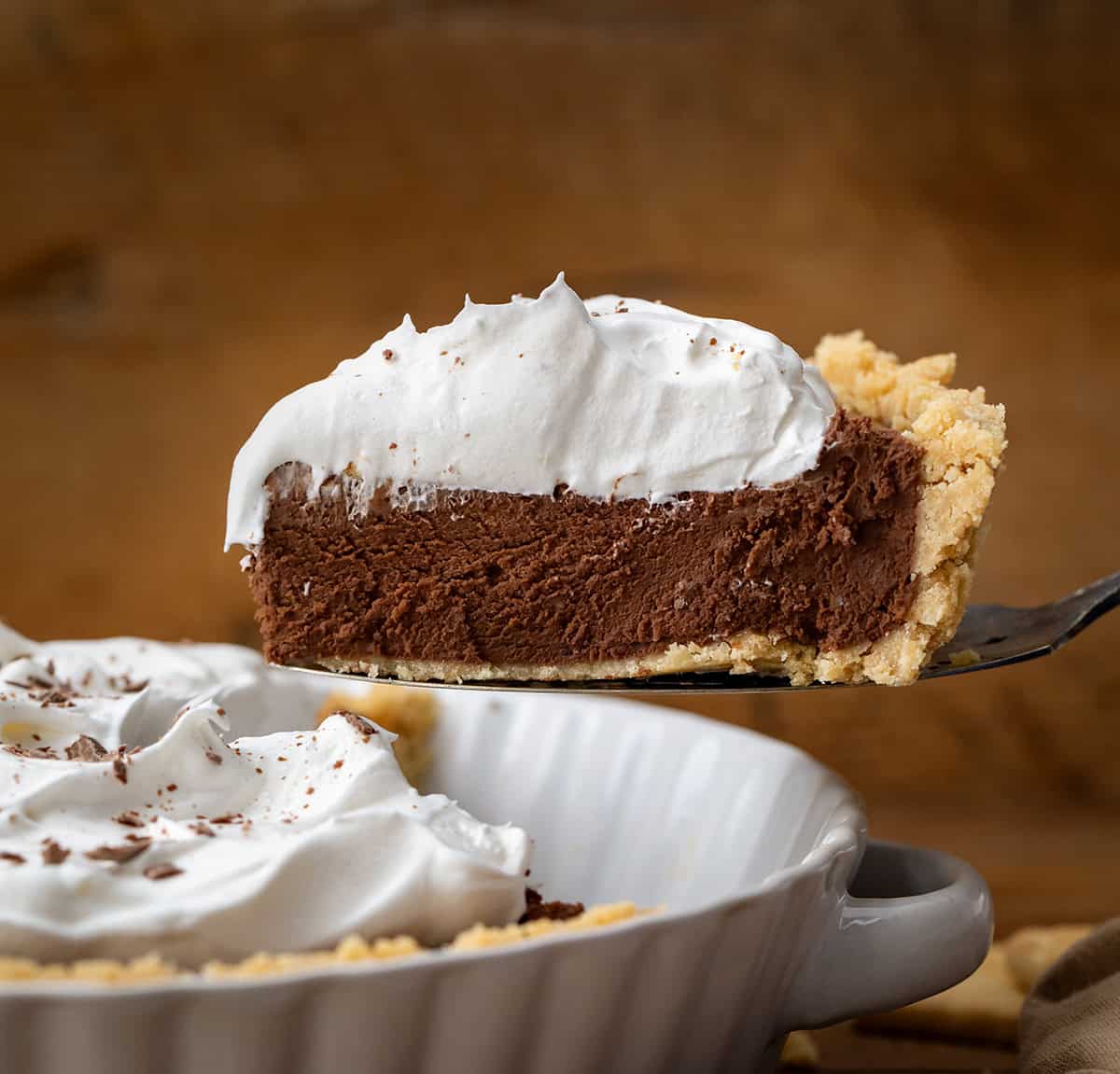 Picking up a piece of Rich Chocolate Pie from the pie plate.