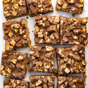 OVerhead of Snickers Special-K Bars Cut Up into Individual Bars and Slightly Separated From Each Other. Dessert, Scootchero Bars, SpecialK Bars, bars, bar recipes, scootch-er-oo bars, snicekrs bars, kid snacks, chocolate, peanut butter, butterscotch, recipes, i am baker, iambaker.
