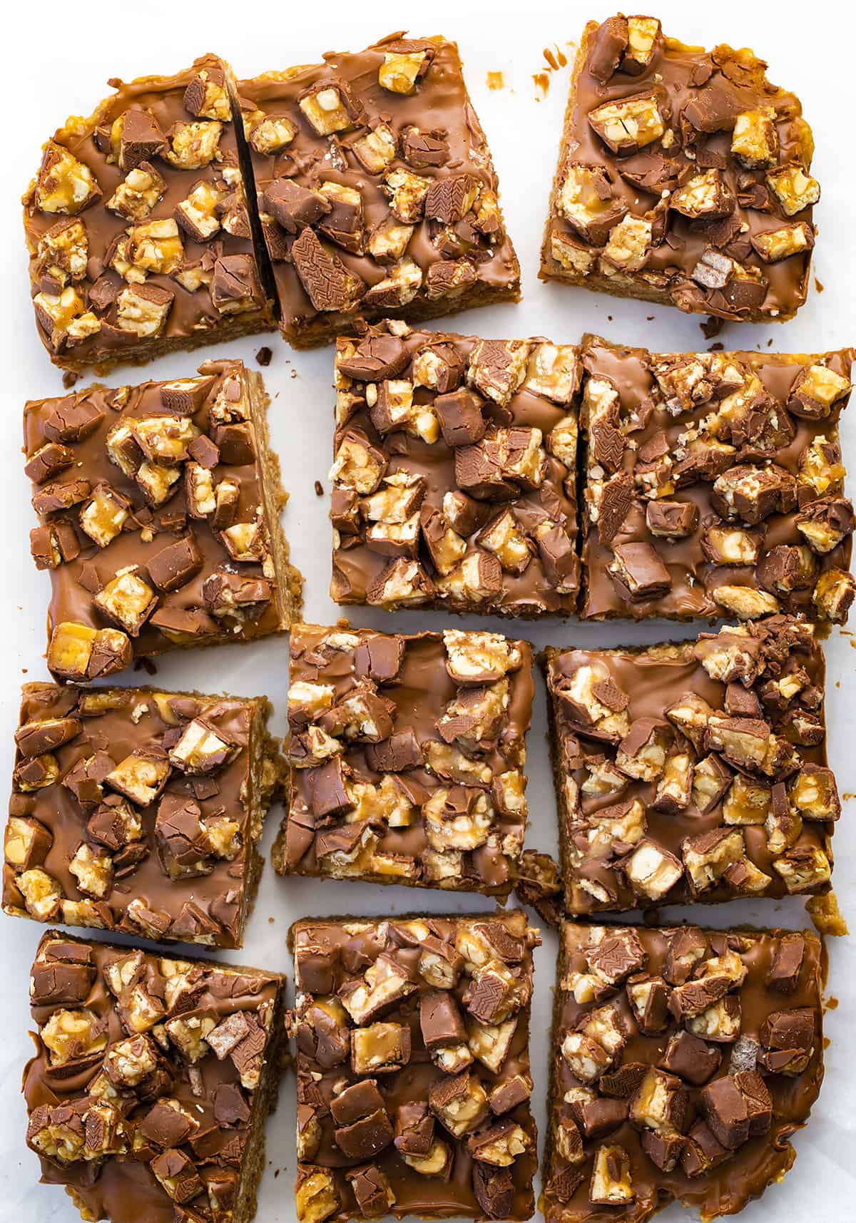 OVerhead of Snickers Special-K Bars Cut Up into Individual Bars and Slightly Separated From Each Other. Dessert, Scootchero Bars, SpecialK Bars, bars, bar recipes, scootch-er-oo bars, snicekrs bars, kid snacks, chocolate, peanut butter, butterscotch, recipes, i am baker, iambaker. 