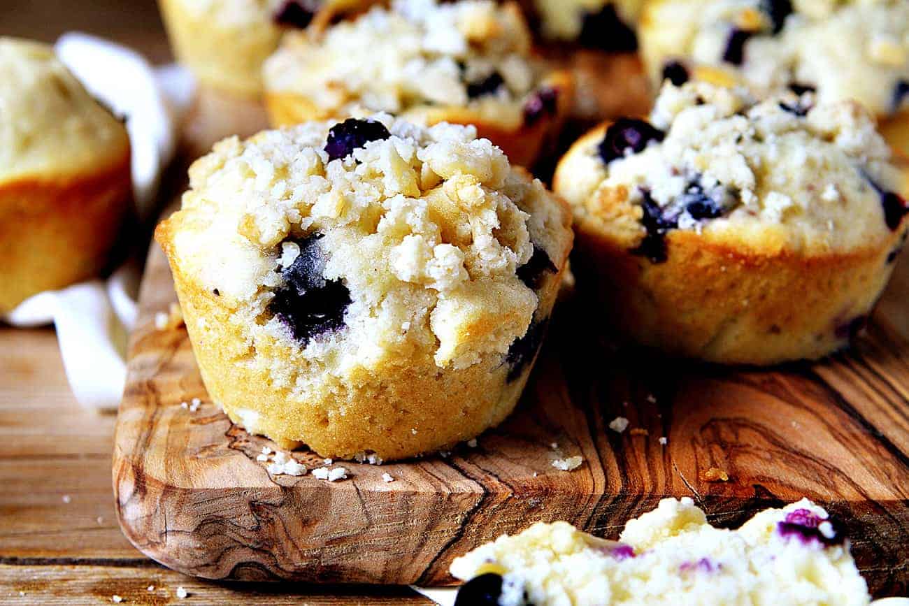 Blueberry Pie Muffins with Pie Crust Tipping on Wooden Board