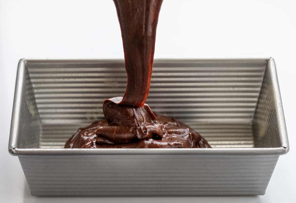 Pouring Chocolate Cake Batter Into Pan to Make Double Chocolate Loaf Cake.