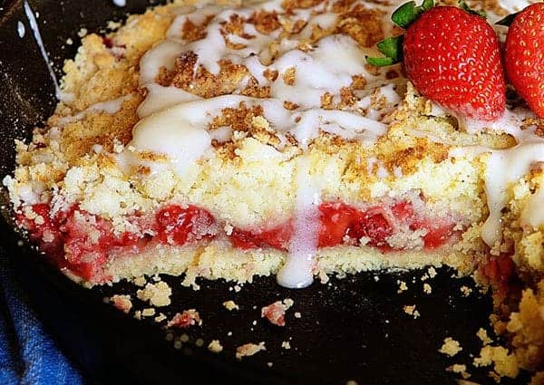Strawberry Crumb Bars in a Skillet Showing Slice Removed and Texture Inside