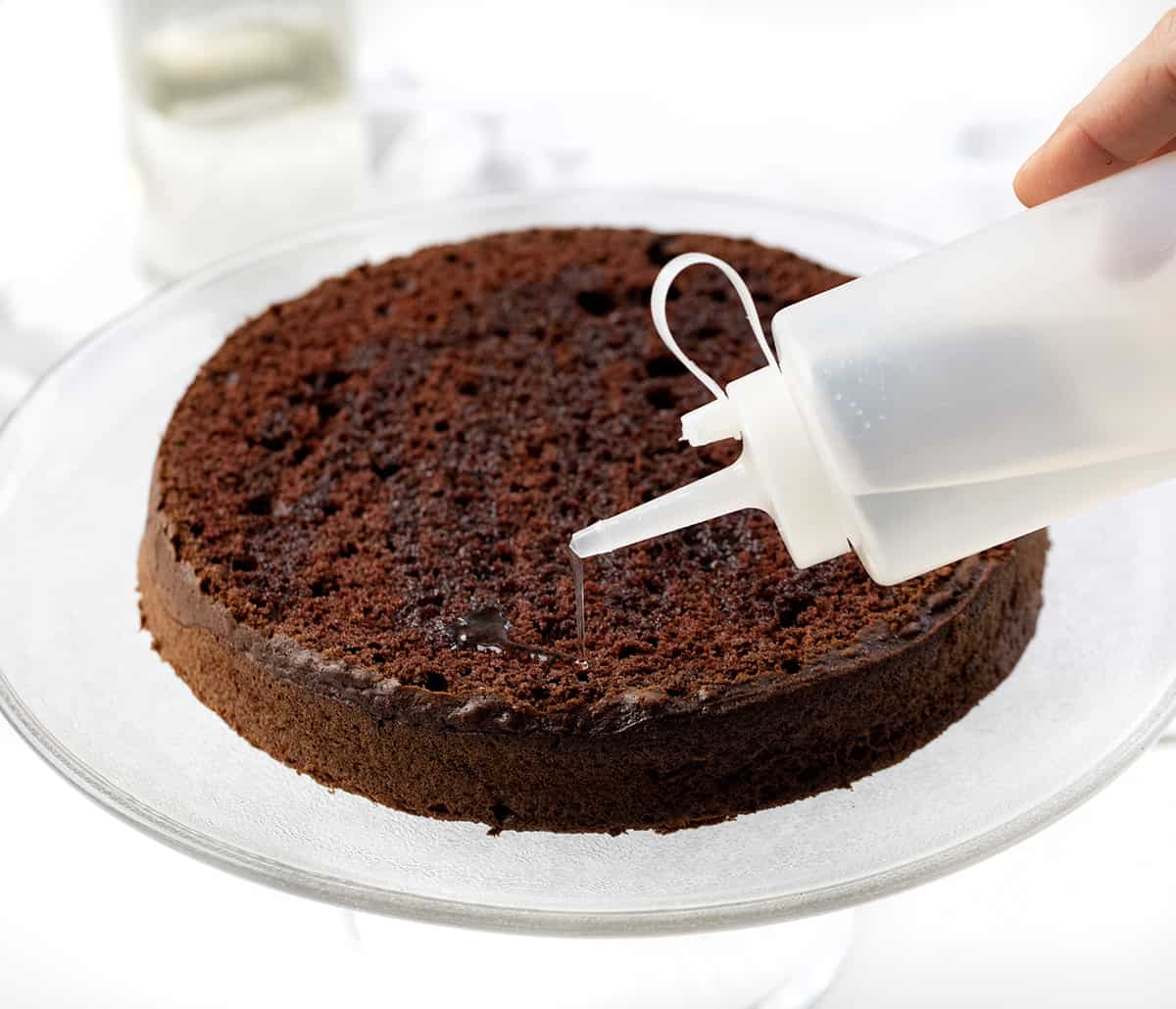 Pouring Simple Syrup Over Cake.