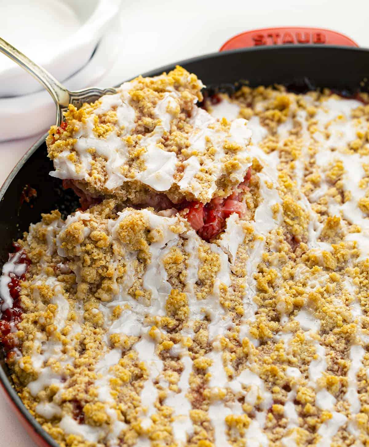Scooping a Slice of Skillet Strawberry Crumble