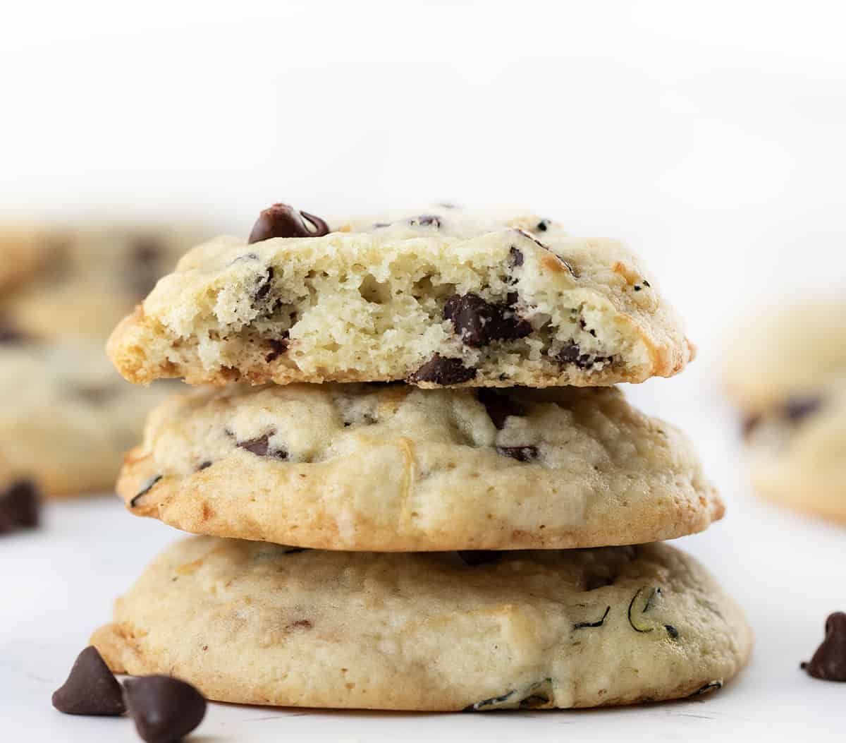 Small Stack of Chocolate Chip Zucchini Cookies with Top cookie halved Showing Inside Texture.