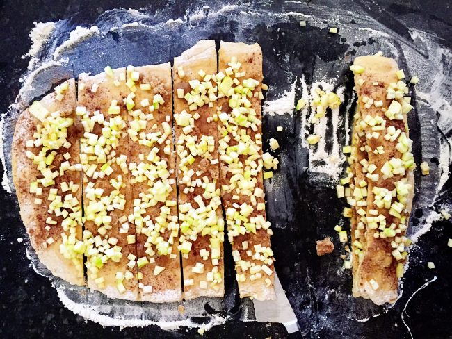 Overhead showing how to cut zucchini pull apart bread into slices