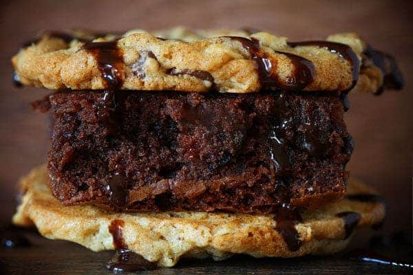 Crownie Sandwich~ Decadent Chocolate Brownie sandwiched between two Chocolate Chip Cookies and Covered in Hot Fudge Sauce