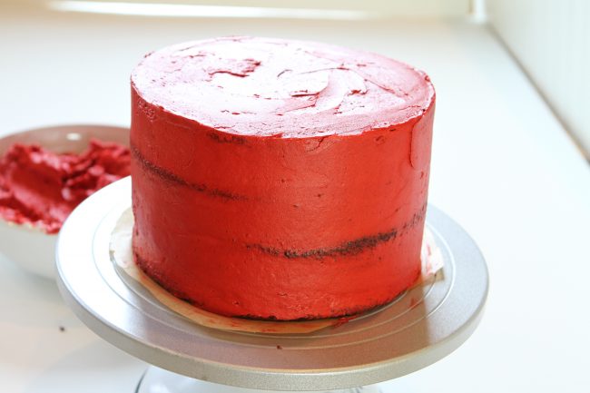 Crumb Coat of red buttercream