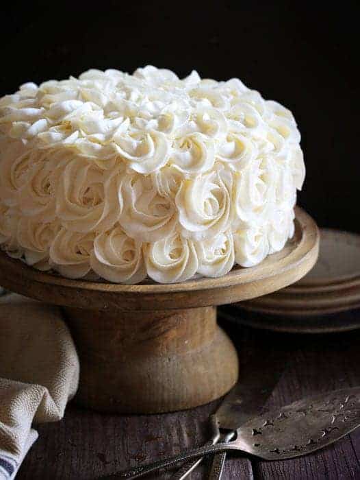 Stunning rosettes cover this flavorful cake... white cake layers complemented with rich fudgey brownie deliciousness!