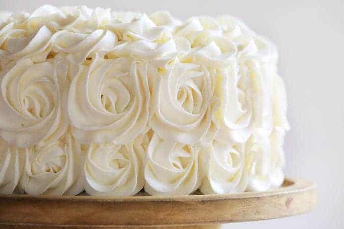 Stunning rosettes cover this flavorful cake... white cake layers complemented with rich fudgey brownie deliciousness!