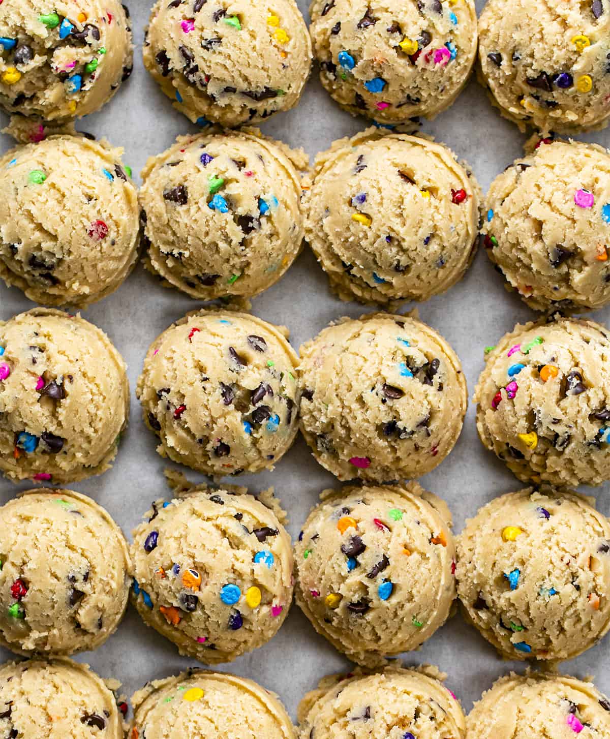 Raw Cookie Dough Batter on a Sheet Pan Before Being Baked. Rainbow Chip Cookie Dough Balls. Baking, Cookies, Cookie Recipes, Dessert, Rainbow Chip, Rainbow Cookies, Rainbow Chip Chocolate Chip Cookies, Soft Cookies, Chewy Cookies, Cookie Dough, i am baker, iambaker