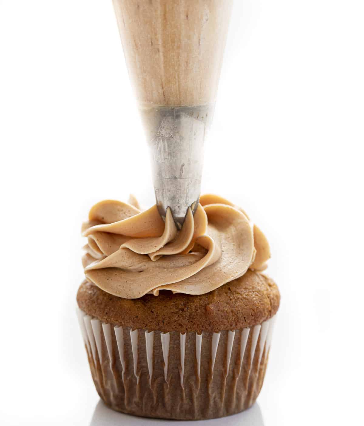 Piping Coffee Frosting onto a Pumpkin Spice Latte Cupcake. Cupcakes, Baking, Decorated Cupcakes, Frosted Cupcakes, Pumpkin Spice Cupcakes, Coffee Frosting, Dessert, Holiday Desserts, Christmas Dessert, Thanksgiving Desserts, Thanksgiving Cupcakes, Starbucks Cupcakes, i am baker, iambaker