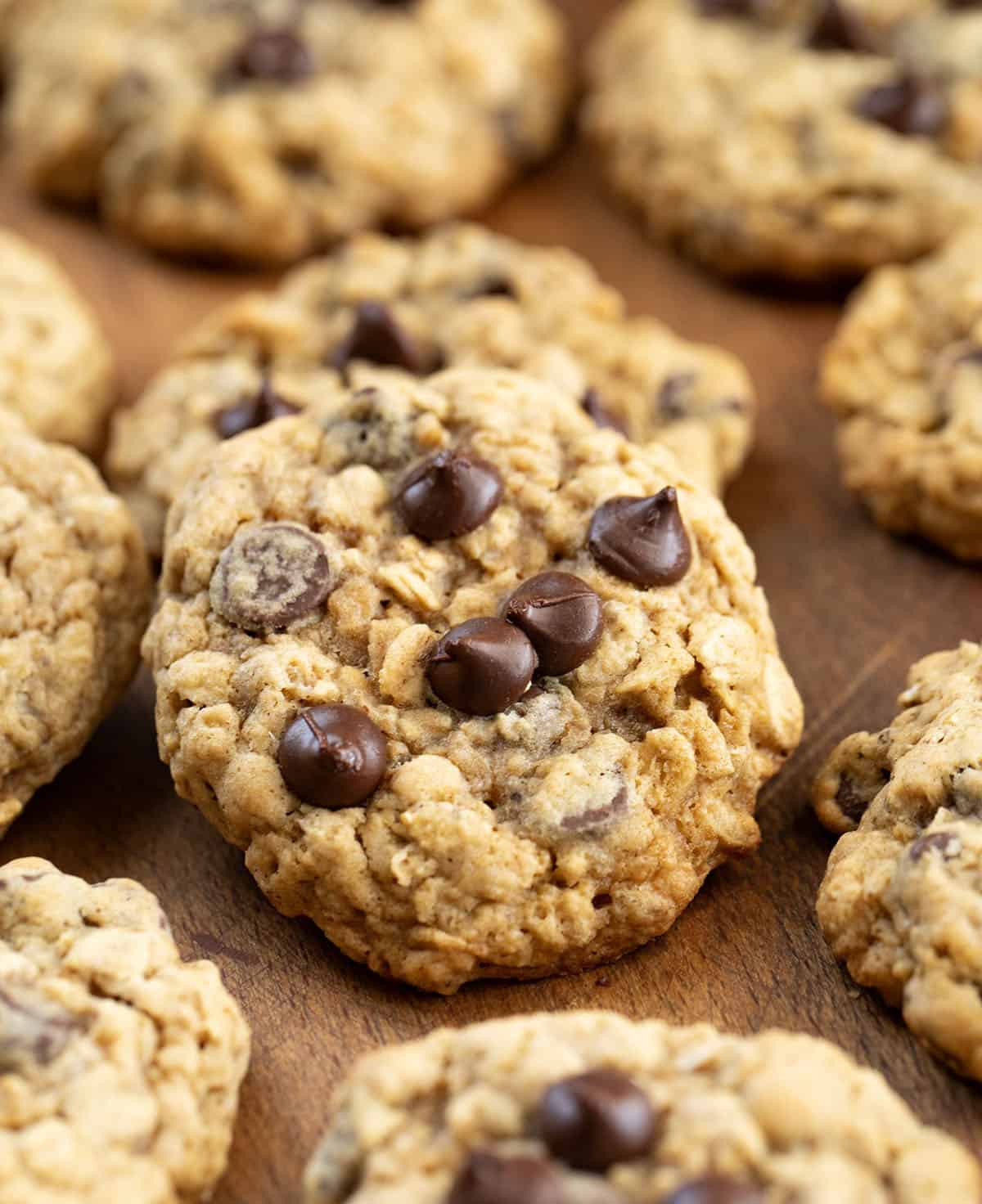 Close up of Oatmeal Chocolate Chip Cookies on a wooden table.