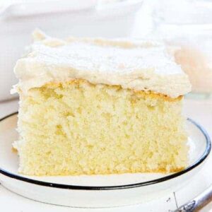 Piece of warm yellow cake covered in Caramel frosting!