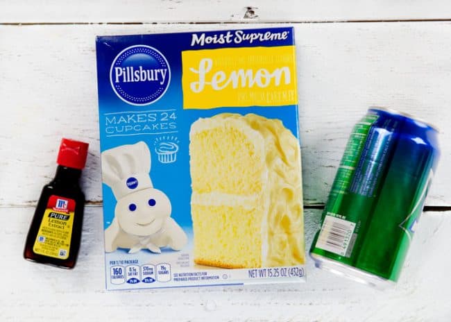 Three ingredients needed for a Blueberry Lemon Soda cake; lemon extract, cake mix, and a can of pop.