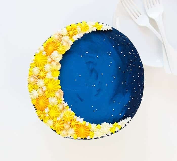 Overhead image of a cake decorated to look like a crescent moon!
