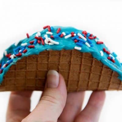 Chocolate taco with ice cream, blue chocolate, and sprinkles!