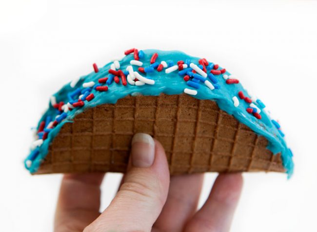 Chocolate taco with ice cream, blue chocolate, and sprinkles!