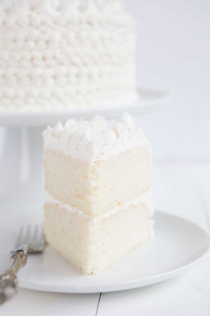 Slice of WASC cake, a semi-homemade white cake recipe.