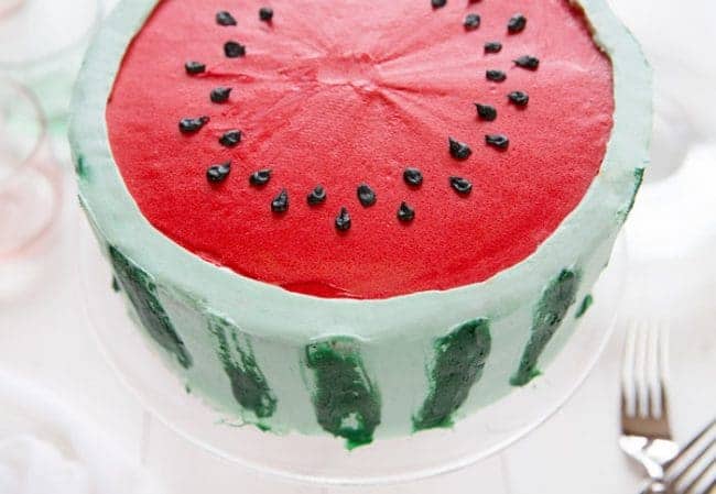 Made with all buttercream, this fun watermelon cake looks like watermelon on the outside!