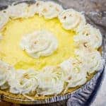 An easy coconut flavored cream pie with whipped cream rosettes and toasted coconut flakes!
