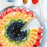 Rainbow fruit pizza with one slice missing... ;)