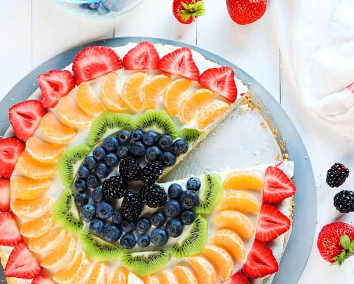 Rainbow fruit pizza with one slice missing... ;)