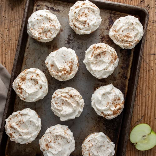 Tray of Apple Pie Cupcakes on a Table with Apples.