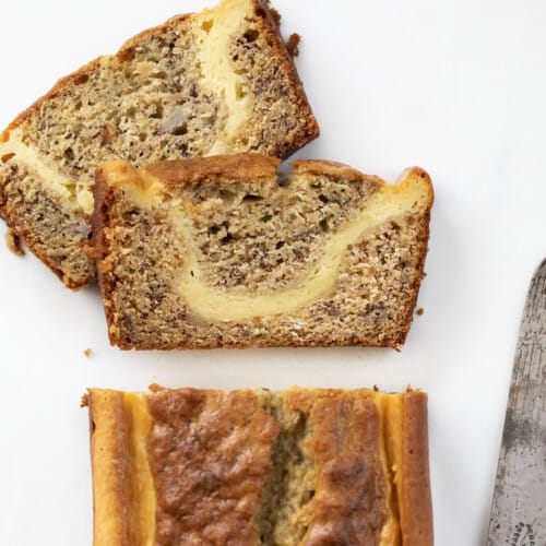 Cut into Loaf of Cream Cheese Banana Bread from Overhead with Knife. Baking, Bread, Cream Cheese, Banana Bread, Light Banana Bread, Two Loaf Bread Recipe, Dessert, Snack, Breakfast Bread, recipes, i am baker, iambaker