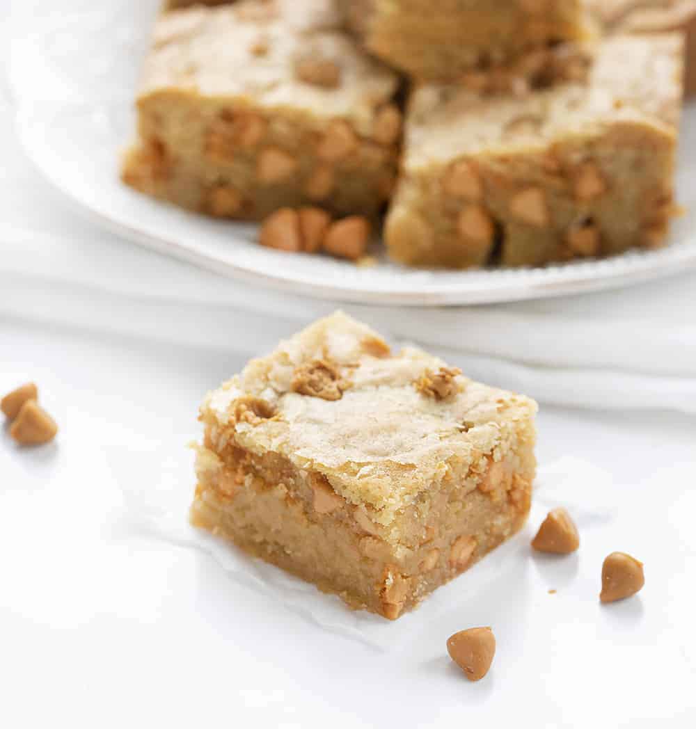 One Blondie Bar on Counter with Blondies in Back and Butterscotch Chips Round it