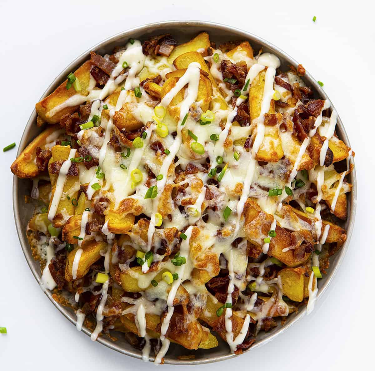 Overhead view of Loaded Cheese Fries Topped with Scallion