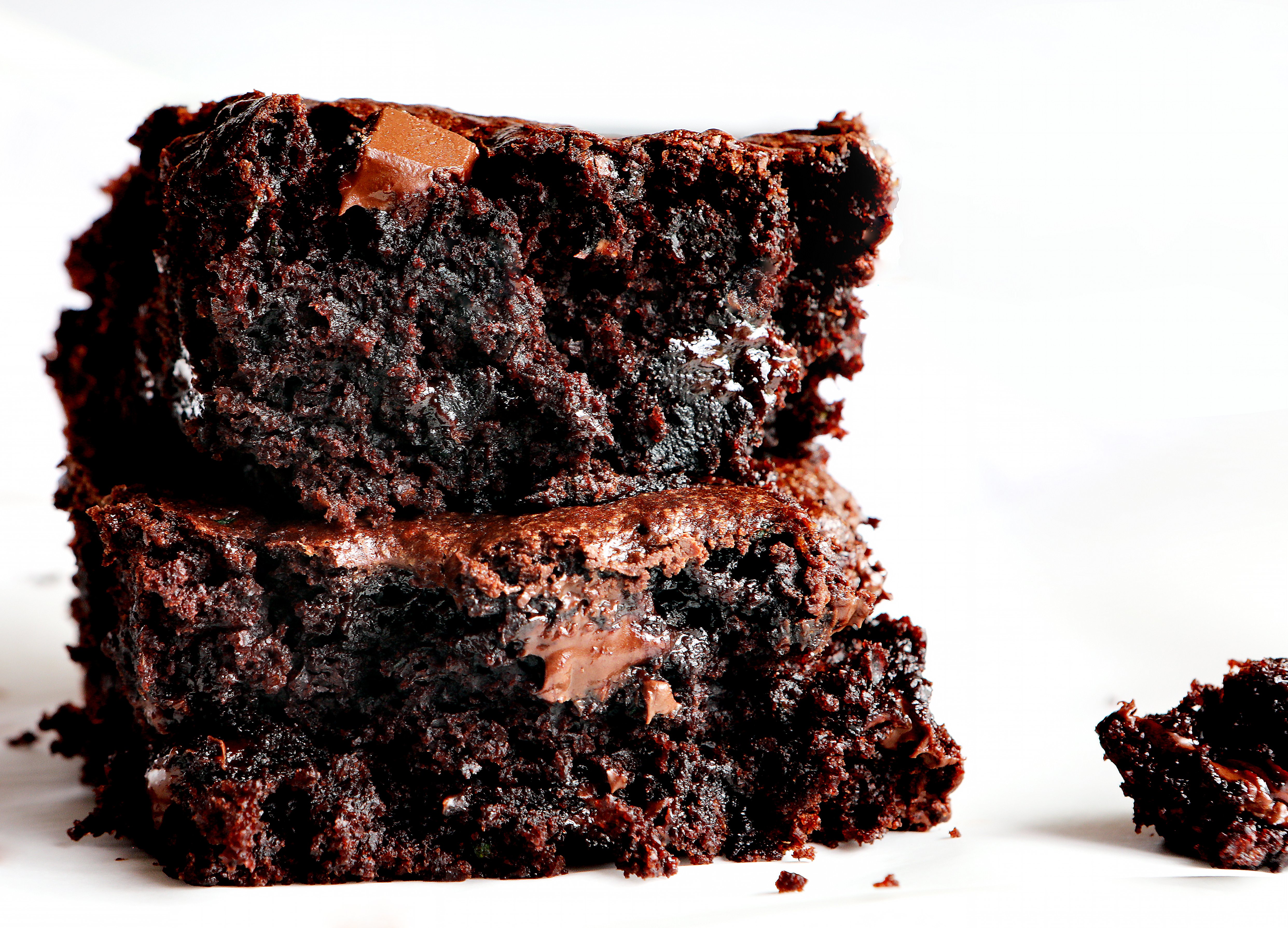Stacked Zucchini Brownies Showing the Inside Creamy Texture